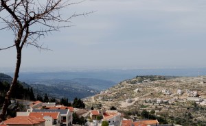 Canaanite city of Hakfira (at top left of hill in center) with Qatanah on the slope and the Ayalon Valley in the distance. In the foreground: Har Adar. Photo: Miriam Feinberg Vamosh