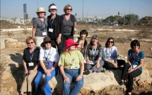 Here we are – a group of Marys, Maries, Marias, Mary Janes… and one Miriam – everyone in our group with a version of the famous name, invited to sit on the rock for a photo to commemorate our visit. Photo: Dr. Bill Creasy